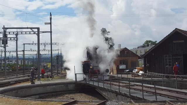 Pacific BR01 01 202 steam locomotive train traveling cross country in Switzerland. It's home-base is in Lyss. A happy site for trainspotters.