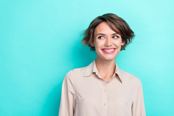 Obraz premium Portrait photo of charming shy pretty lady wear office formalwear career success toothy smiling good mood looking empty space isolated on cyan color background