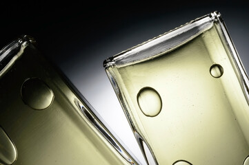 transparent jars with perfume lie on a light background. Close-up