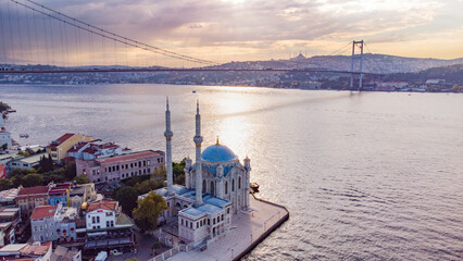 Skyscrapers of istanbul behind Ortaköy Camii mosque and city behind, aerial view of the Bosporous...