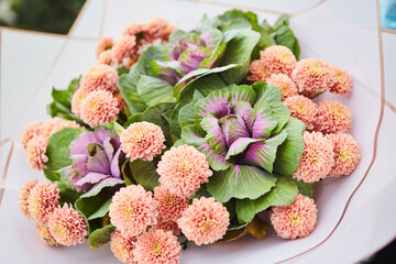 The composition is made by florists from fresh flowers at the party, wedding or celebration.