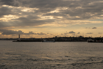 Fototapeta na wymiar Marvelous yellow mystical dramatic sky over Istanbul over a the port of in Kadiköy