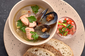 Salmon ears with mussels, sauce and toast