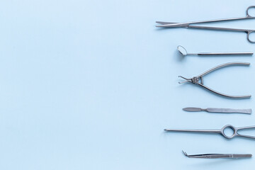 Flat lay of medical steel equipment tools for surgery or dentistry
