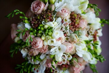 Bright wedding bouquet for the ceremony from fresh flowers