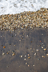 Colorful little stones washed by the shore at a Turkish beach near Çanakkale