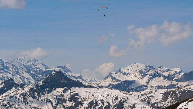 Paraglider over the mountain peaks