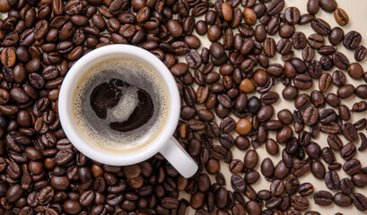 One cup of coffee with crema, Roasted espresso beans on dark background, close-up still life hot beverage, I love coffee concept