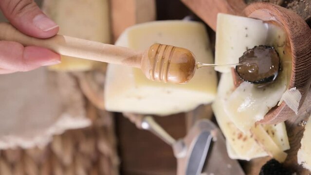 Pecorino cheese with truffle, traditional Italian sheep's milk cheese with truffle. A typical product of the dairy regions of Tuscany and Sardinia. Honey and cheese. High quality HD video