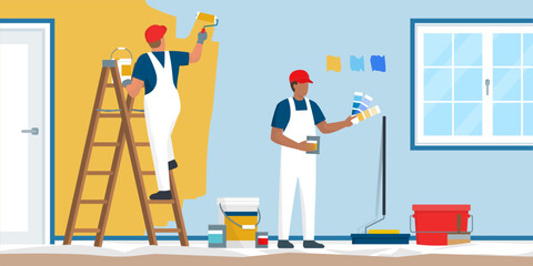 Professional painters and decorators painting a wall © elenabsl