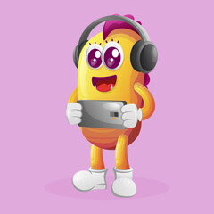 Cute yellow monster playing game mobile, wearing headphones