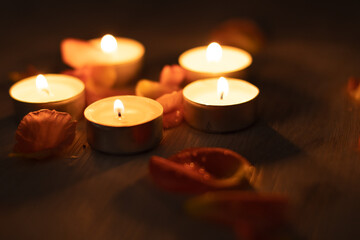 Rose petals and a set of scented candles, a romantic evening.
