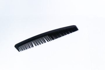 Black hair comb. Isolated on white background.