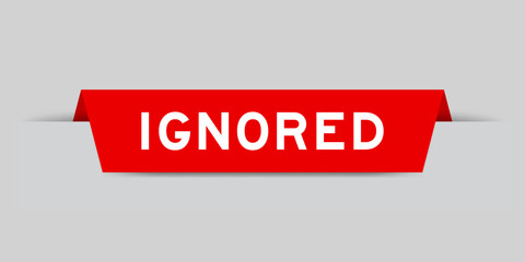 Red color inserted label with word ignored on gray background