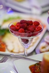 Fruit red ripe raspberries, close-up. Ecological products grown in the garden, vegetarian diet.