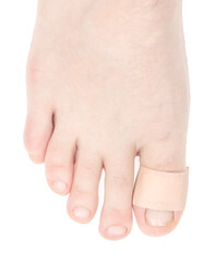 Human leg with medical adhesive wound plaster on toe isolated on white background. first aid bandage