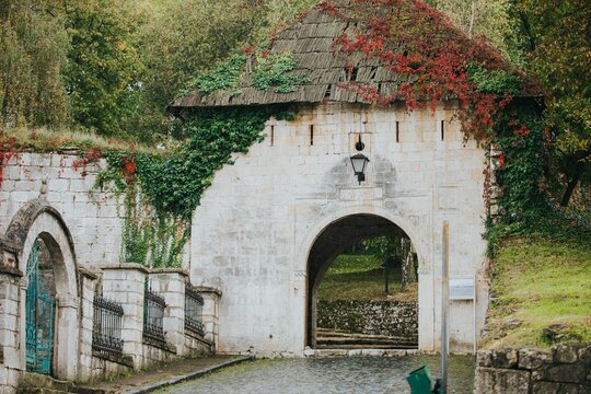 Entrance of the Gradacac Castle covered by green and red leaves in Bosnia and Herzegovina