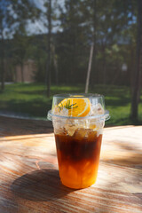 glass of Orange Americano Coffee in a glass on the table