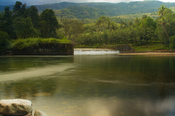 Obraz premium Canal water flowing to meet the river