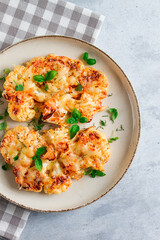 Steak, cauliflower , with cheese , spices, homemade, on a light gray table, close-up, top view, selective focus, no people,