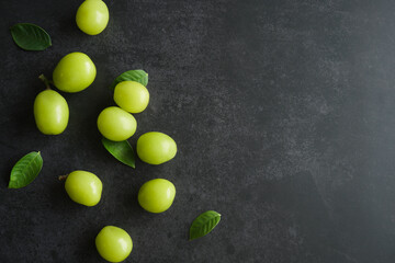 bunch of green grapes on a dark table - 539198436