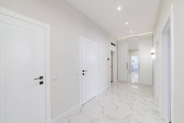 interior design of a corridor in a new house with white walls