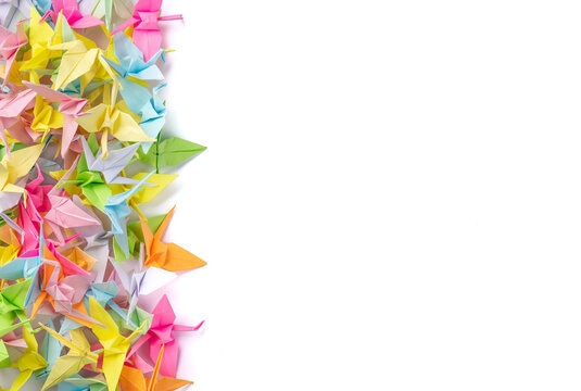 A group of colorful tsuru origamis with copy space. Japanese thousand tsurus legend