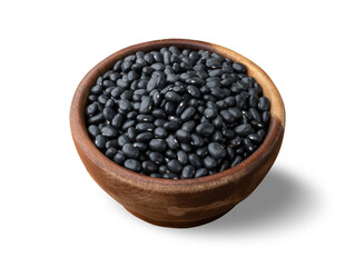 Raw black beans on a wooden bowl isolated over white background