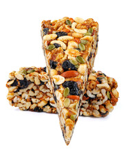 Two pieces of gozinak from different nuts isolated on white background.