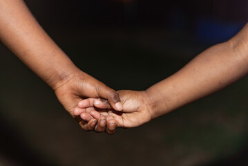 Aboriginal children holding hands