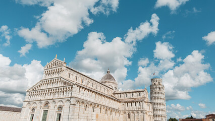 Beautiful historic square with amazing cathedrals and a tower in Pisa, Italy. Travel in Europe