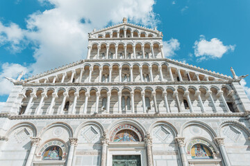 Fototapeta na wymiar Amazing beautiful historical cathedral with columns in the European town of Pisa, Italy. Romanesque architecture
