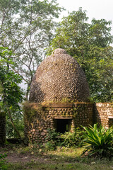 Hindu temple dome emerging from the trees in the forest