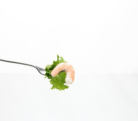 ork with shrimp and salad on white background