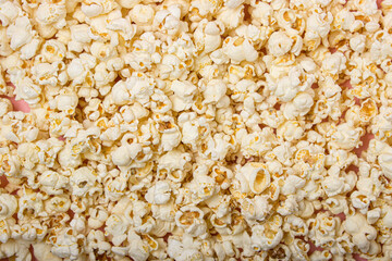 Popcorn in full screen as a background for the image. Delicious salty popcorn