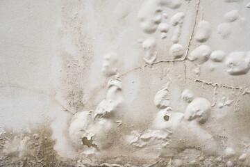 Problem of acrylic white color painting crack abstract surface texture on exterior concrete wall background by humidity.for repair old construction. or vintage renovation home.