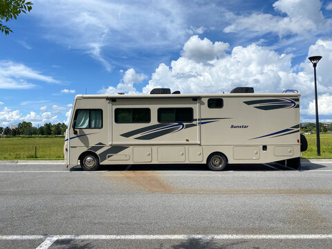 A Sunstar Class A RV Boondocking On A Street In Orlando, Florida.