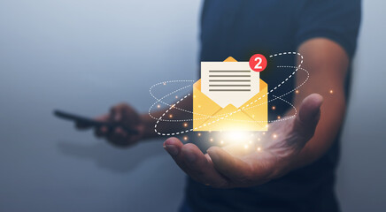 businessman holding email icon Contact us by email newsletter and protect your personal information from spam ideas. notification letter