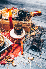 Panier cadeau avec bouteille de vin rouge et conserves 
 gastronomiques