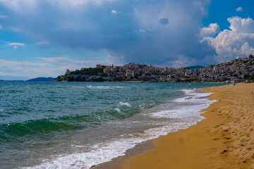 Beach with golden sand and waves in Kavala in Greece