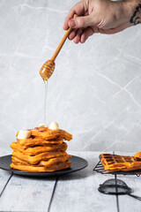food photography in a high key pumpkin waffles and honey