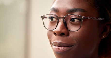 Close Up Portrait Showing Face Of Young Woman Wearing Glasses