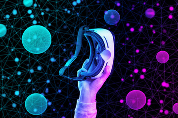A man's hand encased holds VR headset. Black background with neon abstract grid and spheres. The concept of the metaverse, cyberspace and science