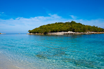 Naklejka premium Island in the sea near the coast of Ksamil in Albania