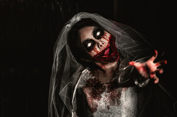 Halloween festival concept,Asian woman makeup ghost face,Bride zombie charactor,Horror movie...