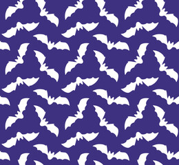 Vector seamless pattern of bat silhouette isolated on purple background