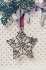 christmas star decoration hanging on dotted background