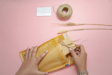 Preparing  package, sending set for an on-line entrepreneur seller with pink background, a white...