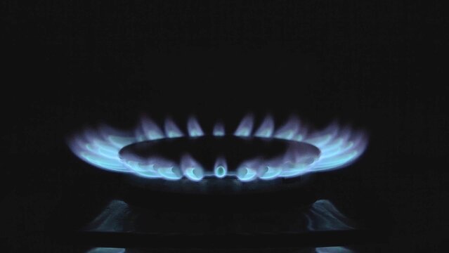 The Blue Flame On The Gas Stove Goes Out. Natural Gas. Kitchen In The House. Cooking Food. Room Heating. Gas Crisis. Energy Resources. Close-up.