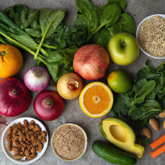 Healthy food clean eating selection fruit, vegetable, seeds, superfood, cereal, leaf vegetable on gray concrete background